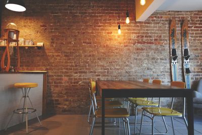 The Groundwork interior with wooden furniture, plants, and warm ambient light