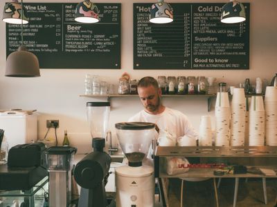 The Groundwork counter, with espresso machine and a row of ceramic mugs